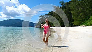 Sexy Young Woman on Vacation on Tropical Island,Walking on Beach with White Sand