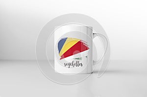 Seychelles flag on white coffee mug.