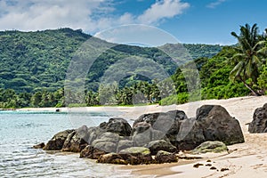 Seychelles seascape with granite boulders in the foreground