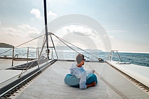 Seychelles, young men on vacation with sailing boat at the Seychelles tropical island