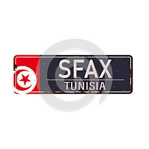 Sfax rusted metal road sign isolated on white background.