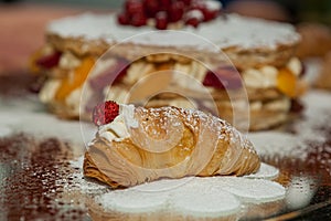 Sfogliatella, typical Neapolitan pastry, with yellow cream and strawberry