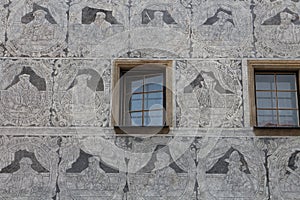 Sgraffito on facade with windows in Slavonice town
