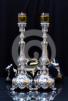 Shabbat candles. Silver candlesticks with olive oil