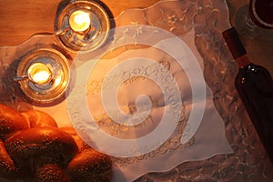shabbat image. challah bread and candles.