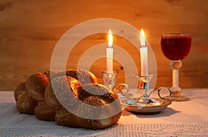 shabbat image. challah bread, shabbat wine and candles