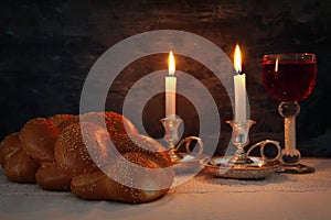 shabbat image. challah bread, shabbat wine and candles