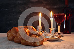 shabbat image. challah bread, shabbat wine and candles