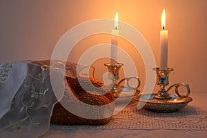 shabbat image. challah bread, shabbat wine and candles