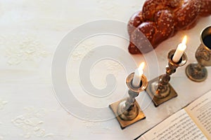 Shabbat image. challah bread, shabbat wine and candles. Top view