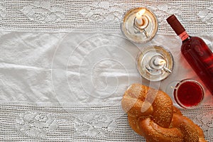 shabbat image. challah bread, wine and candles. Top view