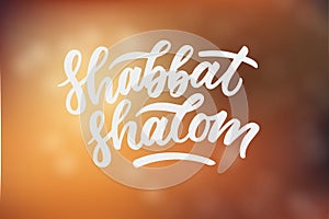 Shabbat Shalom hand drawn lettering phrase. White letters on blur backgroung. Lettering design for invitation, poster