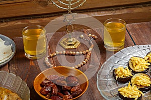 Shabbat table with traditional holiday food menorah