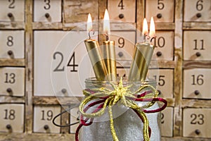 Shabby chic advents calendar with four gold burning candles