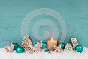 Shabby chic christmas background with candle and gingerbread.