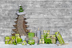 Shabby chic green and white christmas decoration on grey wooden