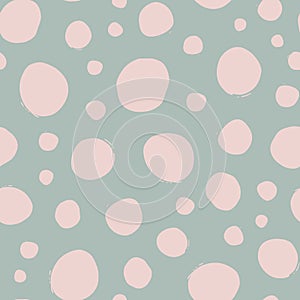 Shabby chic irregular polka dots vector seamless pattern. Trendy seamless pattern with pink dots on light green background. Vector