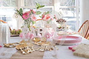 Shabby Chic pink baby shower decorations on table