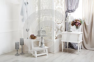 Shabby chic white room interior, wedding decor photo