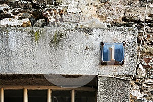 shabby number plate 1 on wall of medieval house
