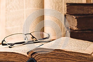 Shabby pages of worn old jewish books in leather binding. Reading Torah. Closeup. Selective focus