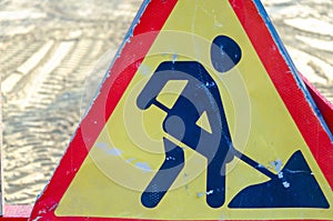 shabby and scratched road sign road repair. against the background of road works