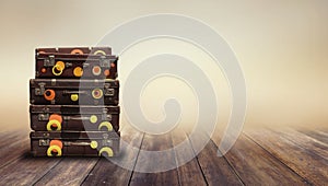 Shabby Vintage Ancient Suitcases. Background of wooden boards.