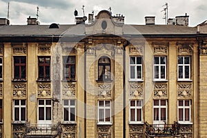 Shabby wall with rooftop of old vintage building, european architecture, residense or appartment