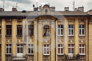 Shabby wall with rooftop of old vintage building, european architecture, residense or appartment photo