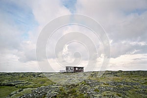 Shack in rugged landscape