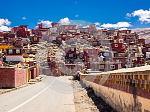 Shacks of buddhist monks on the hill in Yarchen Gar Monastery