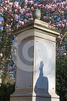 Shade of a cross over a perpetuity concession stone table