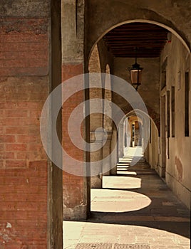 A cloistered pavement in a shopping area of Treviso Italy photo