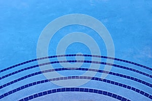 Shades of blue swimming pool tile background