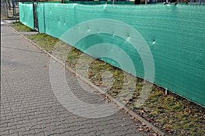 The shading fabric on the wire fence creates a private space and in a moment you have an opaque fence from annoying neighbors and