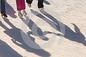 Shadow background of family on the ice rink