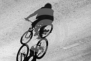 Shadow of the bicycle and the cyclist.