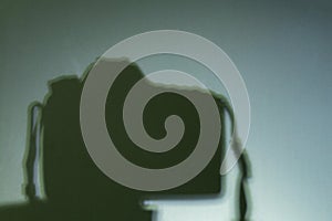 Shadow camera on a tripod in a dark room