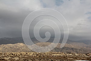 Shadow of clouds on mountains with white snow and sunlight on other mountains