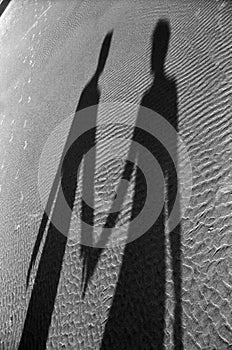 Shadow of couple on beach