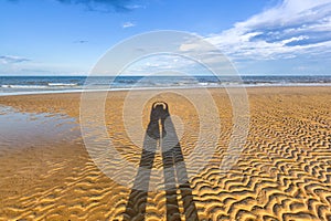 Shadow of couple on beach