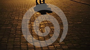 The shadow of a couple in love. A couple walking down the street, silhouettes and shadows of two people on the
