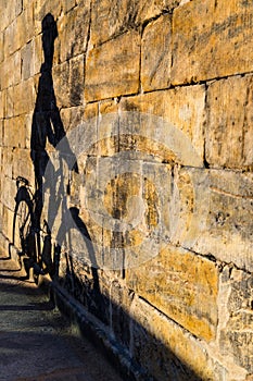 Shadow of cyclist on a wall