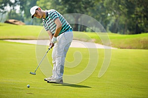 Shadow of golfer That is going to putt