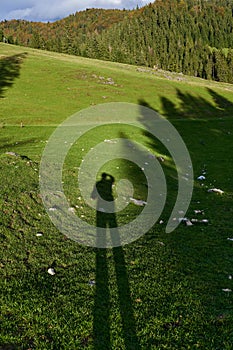 Shadow of hiker in the mountains