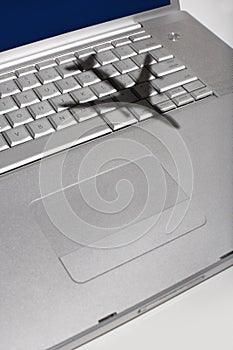 Shadow of jumbo jet over apple macintosh keyboard photo