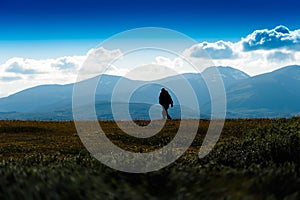 Shadow of lonely traveller in Norway background