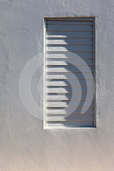 Shadow on a louvered window