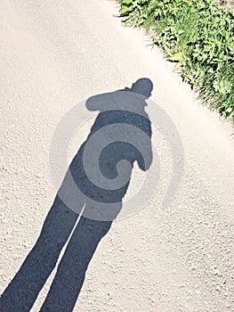 Shadow of a male man in sunny weather