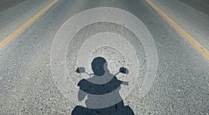 Shadow of motorcycle driving the road,person view helmet camera , copy space